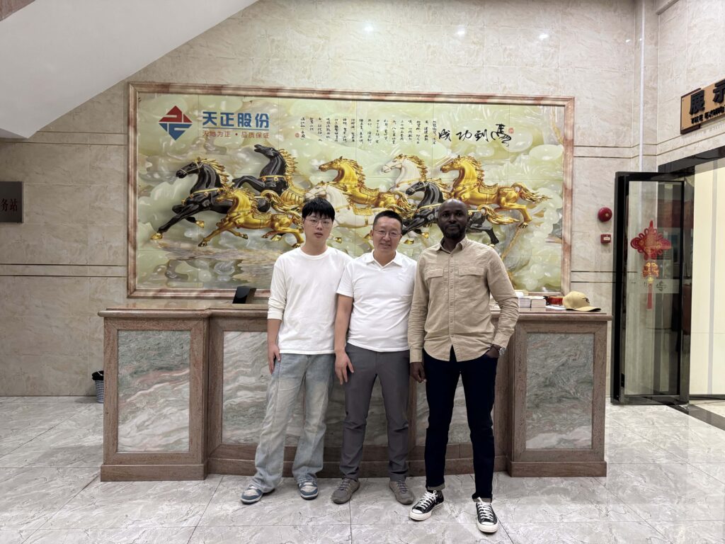 Group photo with Nigerian client after finalizing diaper product specifications at our factory