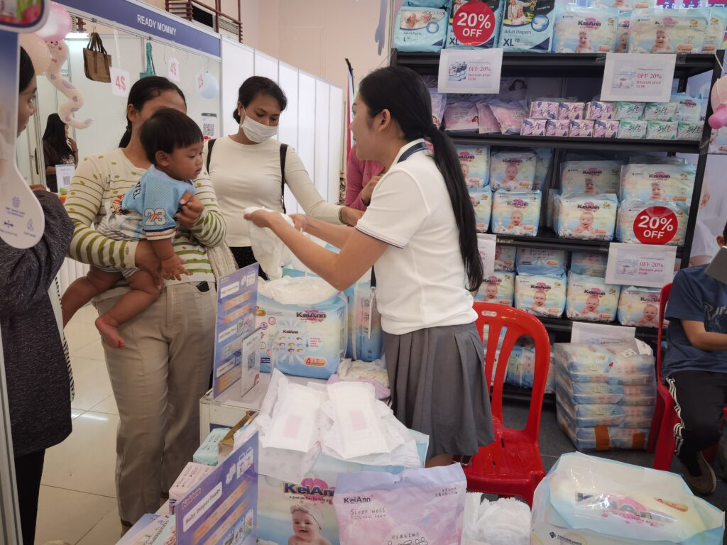 Our team at the booth during the Canton Fair, showcasing private label baby diaper samples to international buyers.
