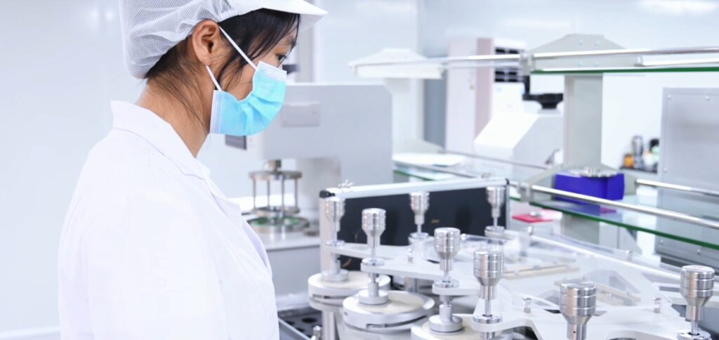 Lab technician conducting diaper quality testing in OEM production facility